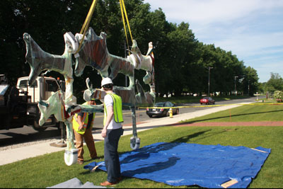 Putting the east wall sculpture on the ground