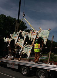 Lifting the south wall sculpture off the truck