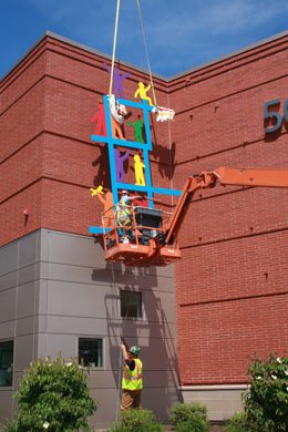 Lifting the East Wall Sculpture to the wall